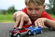Young boy playing with cars